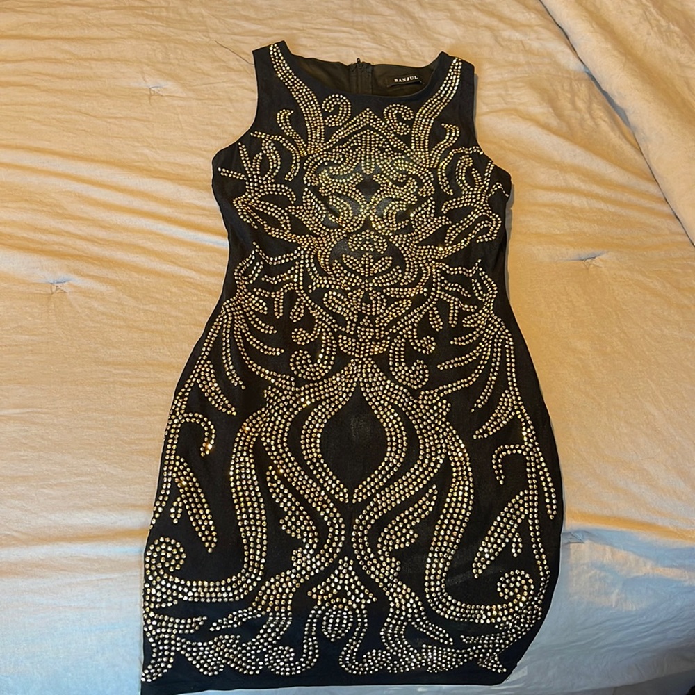 Black with gold embellishments bodycon dress. Perfect for Vegas or New Years!